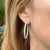 3.62 CTW Diamond Three Row 18 Karat White Gold In & Out Hoop Earrings