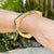 1970's 14 Karat Yellow Gold Asymmetrical Vintage Hinged Bangle Bracelet